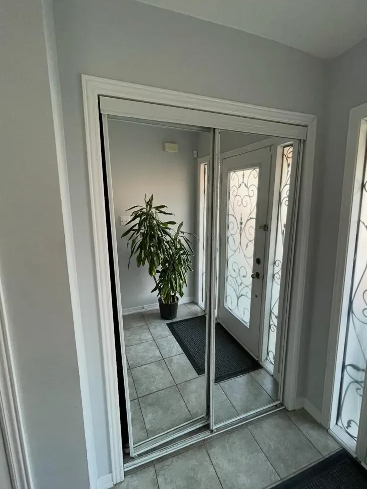 Hardwood staircase landing before renovation